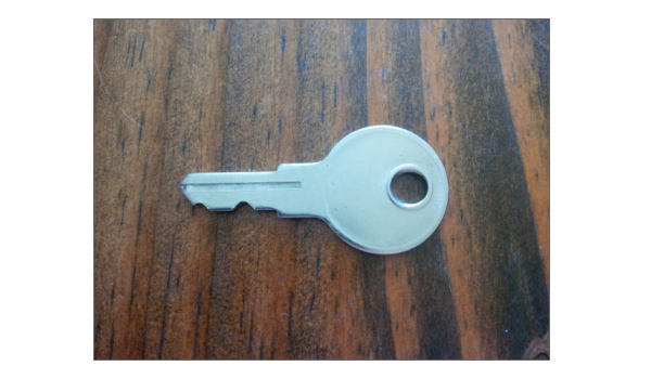 metal key on wood table